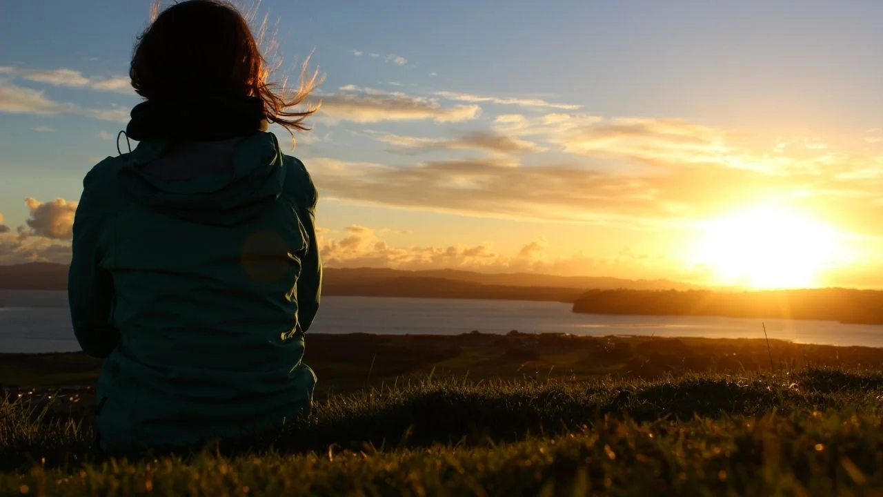 woman watching sunrise