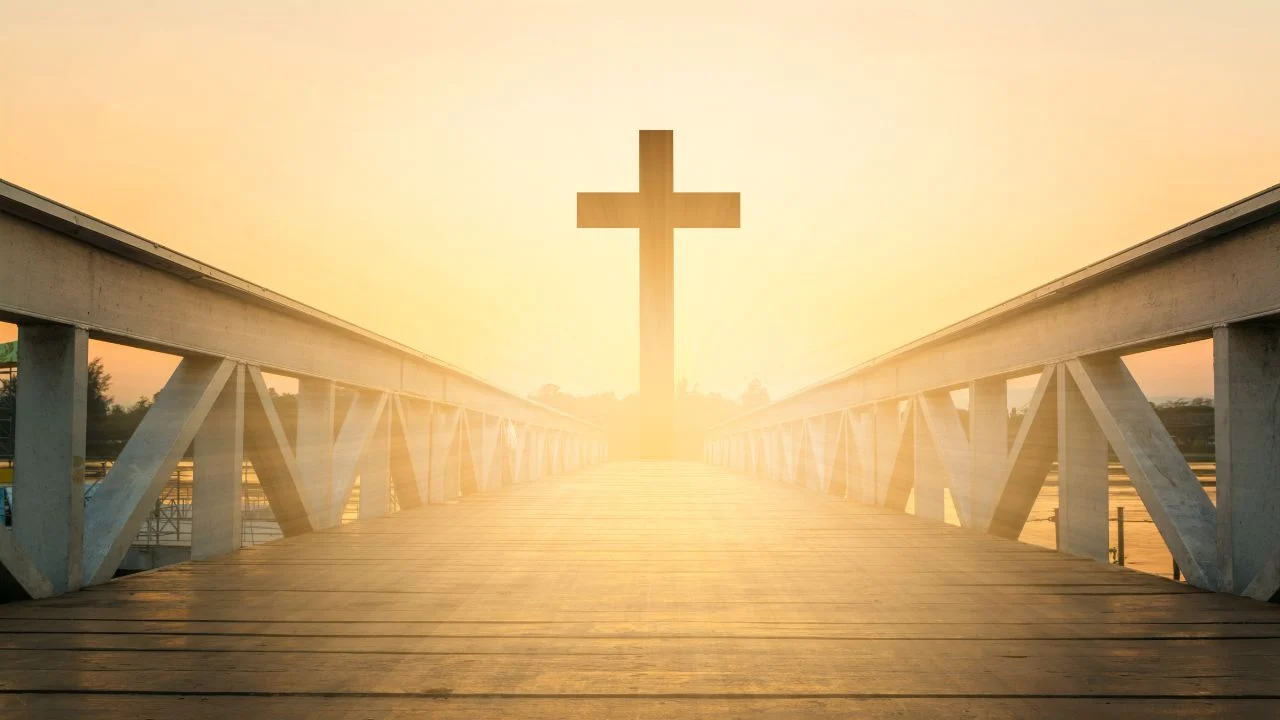 Bridge and cross at sunset