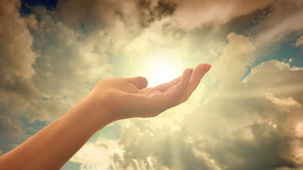 Hand lifted in prayer