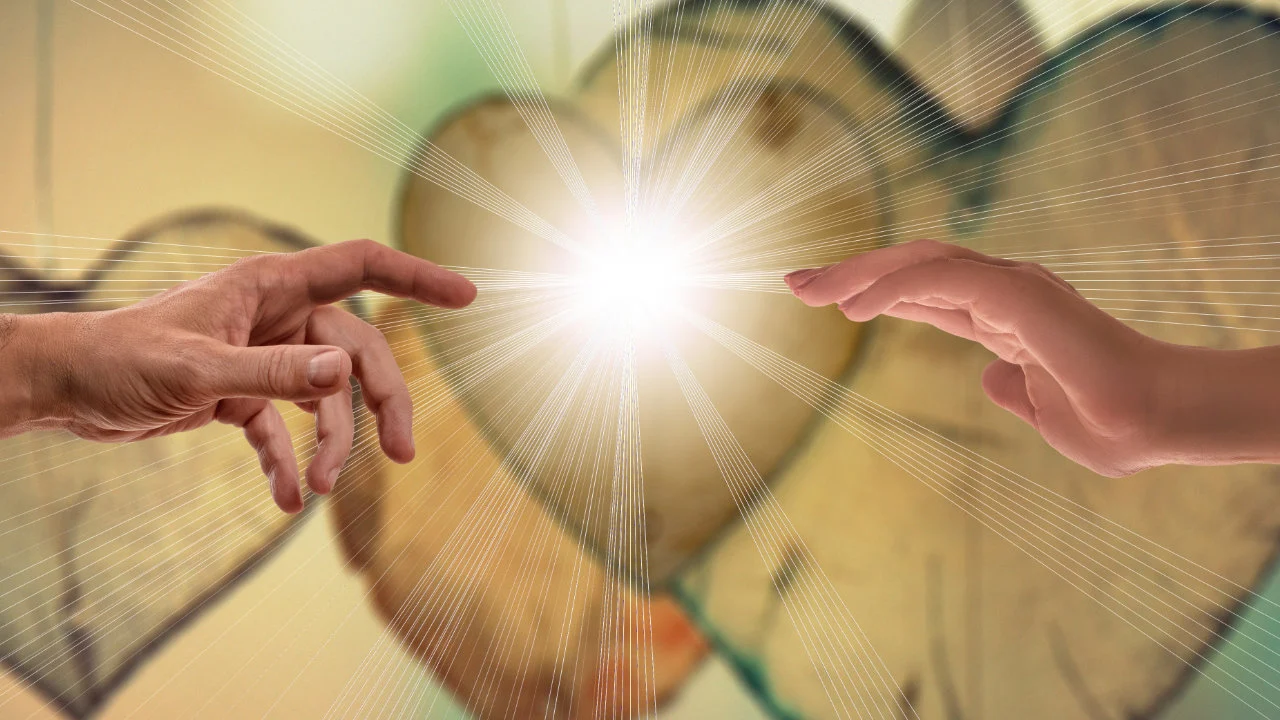 two peoples hands reaching out to one another