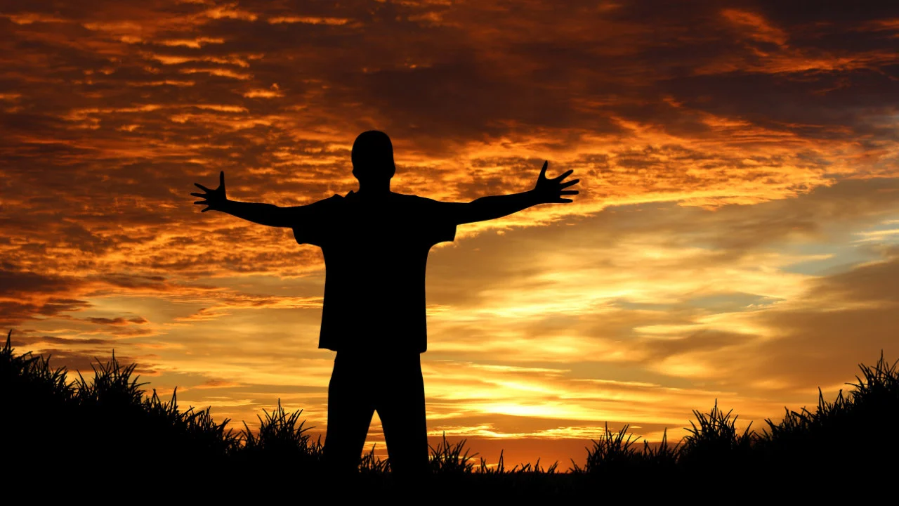 silhouette of a man against a beautiful sunset