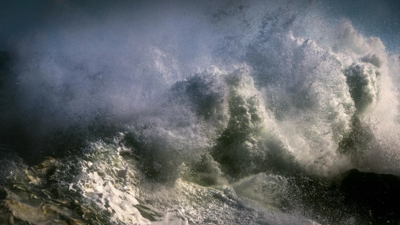 huge waves crashing on the shore