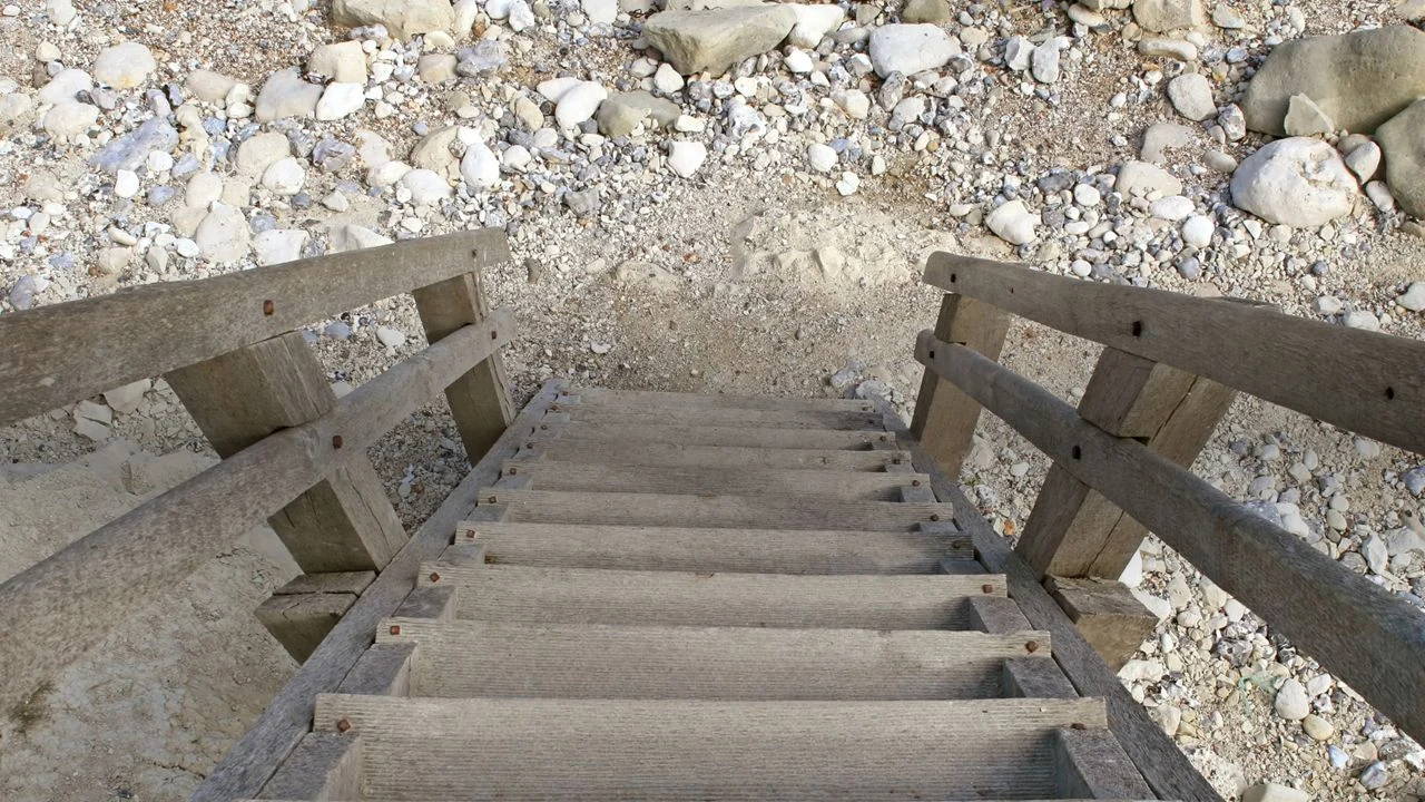 Staircase leading down to rocky ground